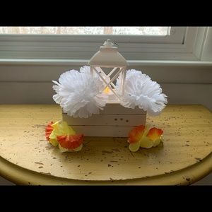 Crate and lantern centerpiece with yellow/orange flowers